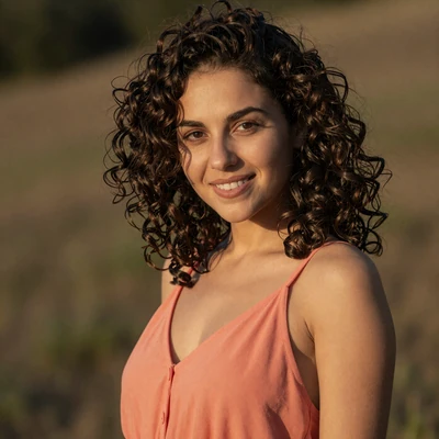 Darya, 27-year-old Moldovan graphic designer from Chisinau with curly dark hair, creative professional seeking love